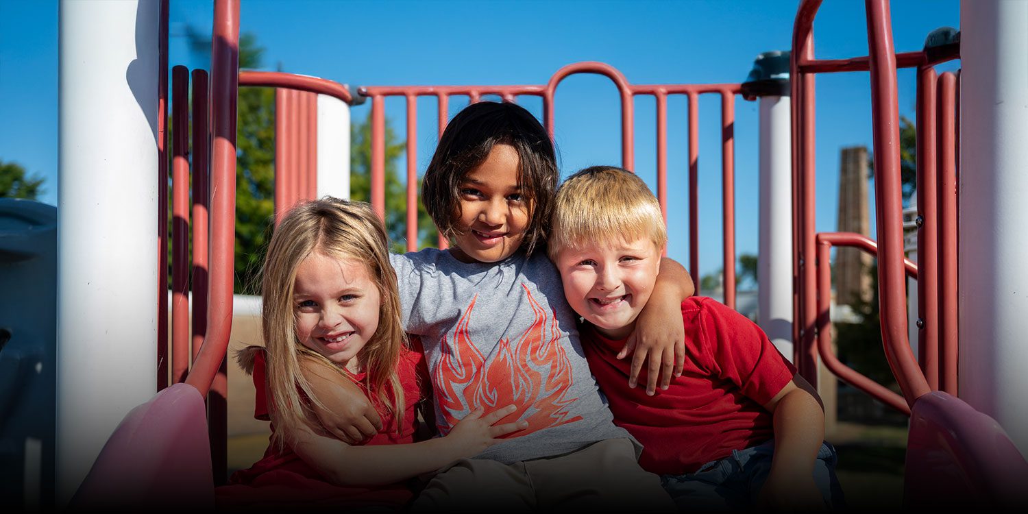 Smiling students on the school playground